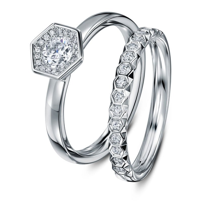 British Wedding Rings and Contemporary Eternity Rings by Award-Winning Designer Andrew Geoghegan. Image shows the platinum Chapiteau diammnd wedding ring with the Chapiteau Engagement Ring
