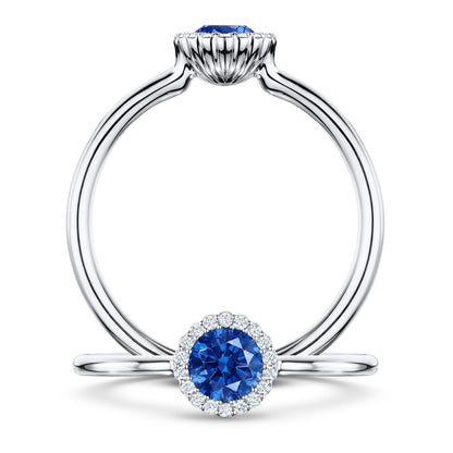 Rivage Medium Blue Sapphire Ring with white Diamond halo in Platinum, front and side views