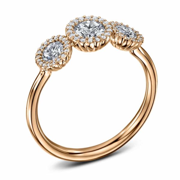 Cannelé Trois three stone engagement ring in 18ct rose gold with fluted halo settings
