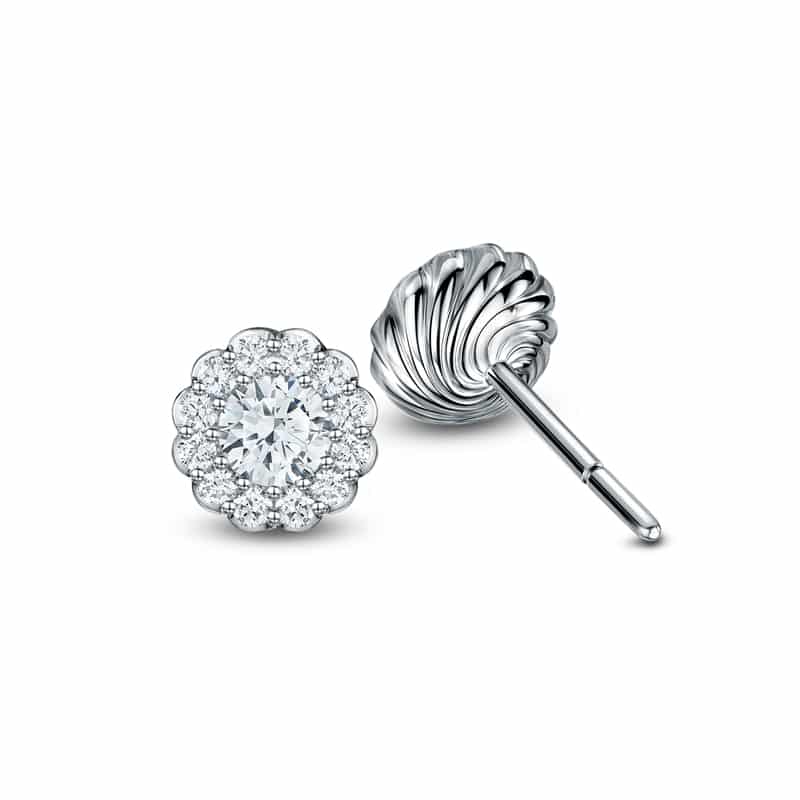 Cannelé Twist diamond stud earrings in white gold, shown front and fluted reverse