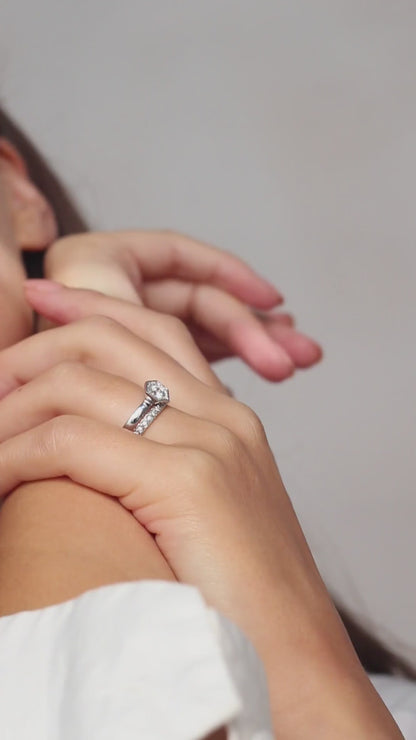 Chapiteau de Diamants hexagon halo engagement ring by Andrew Geoghegan, shown with its matching wedding band