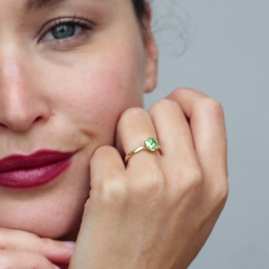 Asteria tsavorite halo engagement ring by Andrew Geoghegan