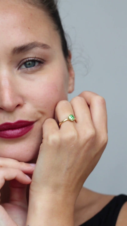 Asteria tsavorite halo engagement ring by Andrew Geoghegan