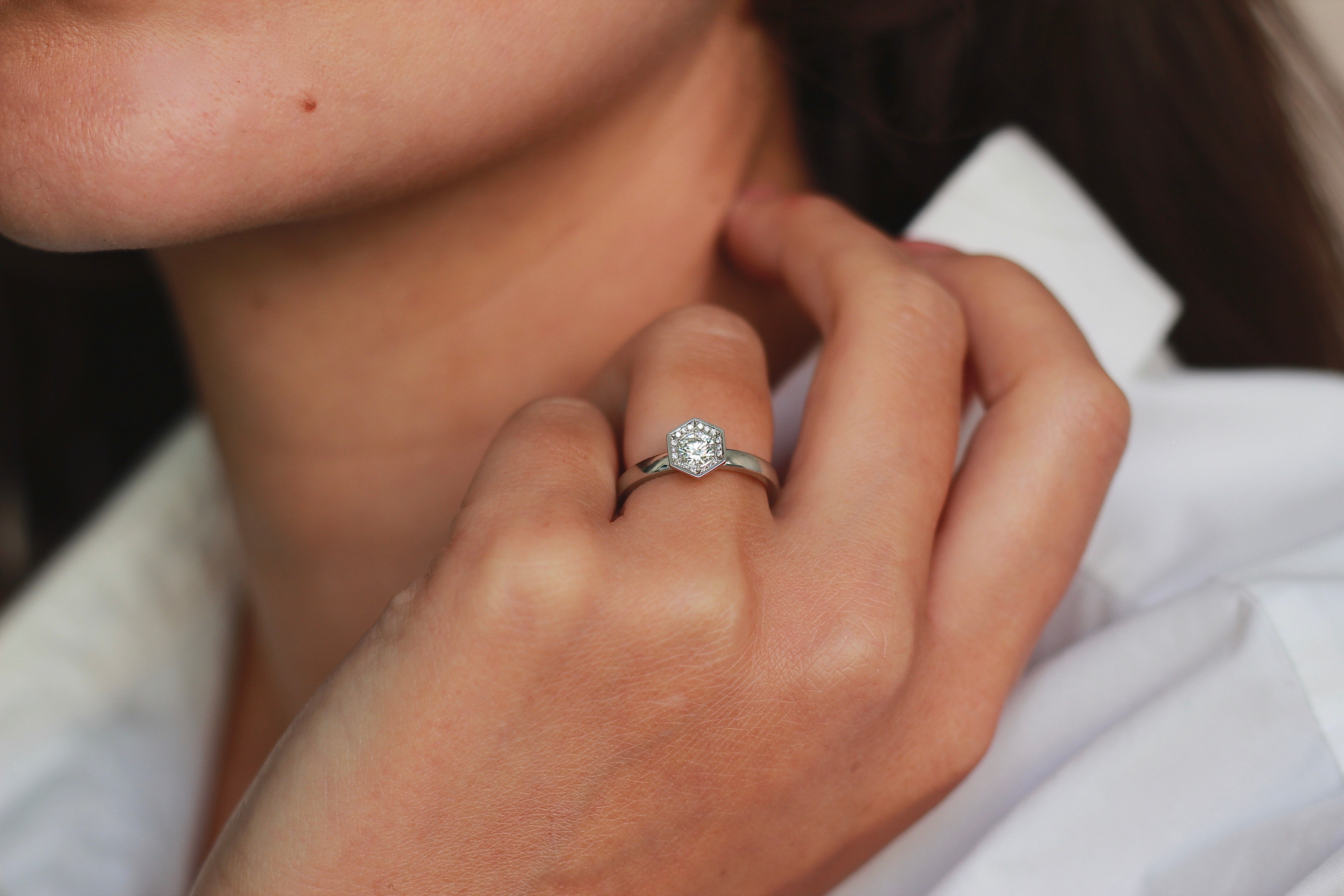 Chapiteau diamond engagement ring worn on the hand